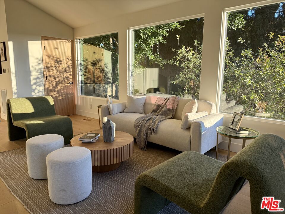 Perched on a hilltop in Mt. Washington, this design-forward 3-bedroom, 2.5-bath retreat spans 1,695 sq ft and captures sweeping views that stretch to the Griffith Observatory. With golden sunsets pouring into the living room, dining room, and kitchen through expansive windows and soaring ceilings, the home offers a daily connection to light, air, and horizon. Thoughtfully reimagined with a Japandi-inspired aesthetic, natural wood details meet clean, modern lines for a warm yet refined atmosphere. Custom cabinetry, natural stone counters and backsplash, high-end Thermador appliances, and wide-plank wood floors bring elevated craftsmanship to every corner. Upgrades include new wiring, plumbing, electrical systems, HVAC, and roof. A new insulated garage door with a silent motor adds to the ease of daily living.The serene primary suite opens to a spacious wooden deck that flows seamlessly into a Japanese-inspired garden. Designed with zen-like intention, the landscape features stone, greenery, ambient lighting, and a wooden gazebo creating an ideal backdrop for morning tea, evening gatherings, or quiet reflection.Blending tranquility with convenience, this home is minutes from the heart of Highland Park, Glassell Park, and York Blvd. Whether you're savoring sunsets at home or exploring nearby dining and culture, this is a retreat that balances modern luxury with soulful living in one of Mt. Washington's most sought-after hillside communities.