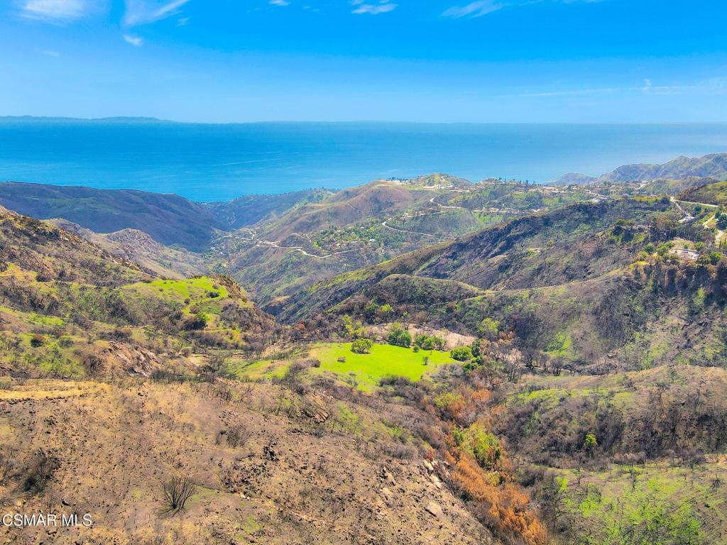 Nestled in one of Topanga's most desirable and private settings, this breathtaking 2.5+ acre parcel offers panoramic ocean and mountain views. Surrounded by multi-million-dollar estates, this beautiful property presents a rare opportunity to build a custom home or create a private sanctuary immersed in natural beauty. With endless possibilities and a plethora of potential uses - from a modern estate to an artist's retreat or wellness escape - this is a true blank canvas for your vision. A rare offering in a coveted location, combining serenity, seclusion, and world-class views.