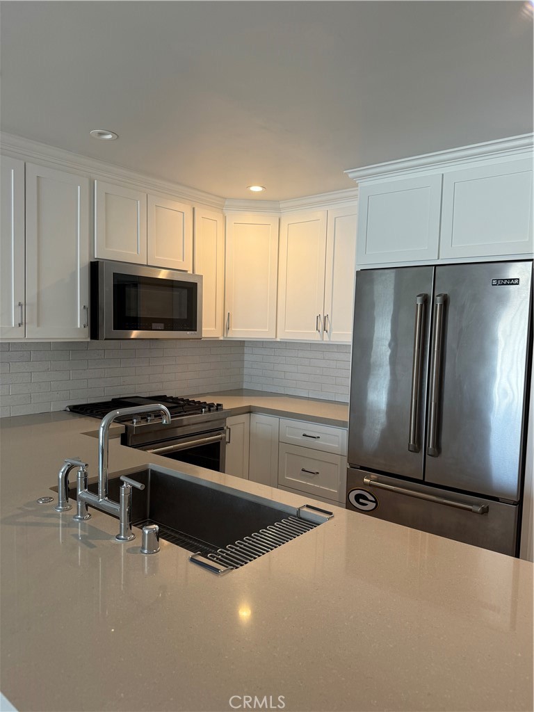 Completely remodeled down to the studs. Quiet residential walk-street located in North Hermosa, 7 houses away from the beach. Spacious kitchen with abundant counter space and new cabinetry that will satisfy the fussiest gourmet. Refrigerator, dishwasher, microwave and oven are included.
The largest bedroom can easily fit a king bed and has its own private bathroom and a wall 100% dedicated to closet space.
The second bedroom is roomy, faces west and has a large closet. New window coverings in the bedrooms. Small patio off of the living room to get your ocean breezes. This is a must see and will not last.
2 car covered parking. Common laundry room as well as a bike room.
Separate storage cabinet dedicated for this unit. Ocean and Malibu views from the common roof top deck.
No smoking. No pets.
