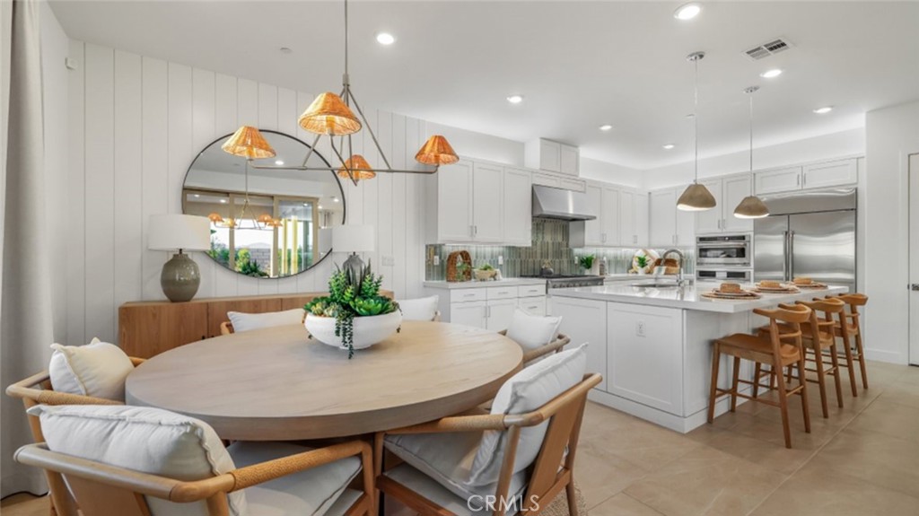 A spacious open floorplan shared between the family room, kitchen and dining room can be found at the heart of this single-level home, offering access to the California Room through stackable sliding glass doors. The luxe owner’s suite is situated at the back of the home, while a secondary bedroom and flex space can be found can be found off the entry. A must see. Gated 55+ Active Adult Community.