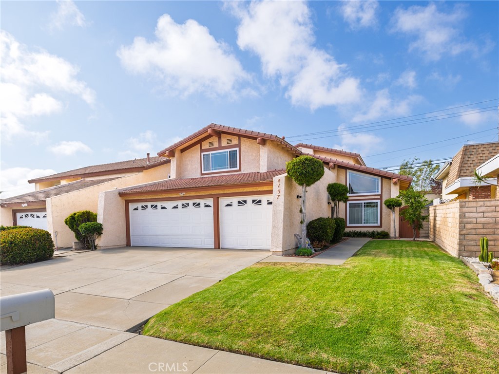Welcome to this spacious family home in the heart of West Torrance. Great floorplan with a bedroom and bathroom downstairs. Perfect for visitors or extended family stays. Vaulted ceilings gives this home a light bright wide open feel. A chandelier greets you overhead as you step into the entry way. One step down to a formal living room with a wet bar. A step up to a formal dining area with views of the backyard. Just off the dining area is the kitchen with stainless steel appliances, granite countertops, double oven, recessed lighting and an informal dining area as well. Step down to a family room with a cozy fireplace. Newly painted interior, tile roof, double pane windows, copper plumbing, forced air heating, automatic sprinklers & lots of storage space. Sliding doors off the family room lead to a very large manicured back yard & patio perfect for entertaining. Huge lawn area, mature landscaping, fruit trees all nicely maintained. Block wall fencing. Upstairs leads you to a large south facing bedroom with views of Palos Verdes. Jack and Jill bathroom shared with another bedroom. Primary suite is roomy and has a bonus step up retreat you can use as a reading room or create that perfect in home office. Deck off primary suite. Primary bathroom off retreat. Beautifully landscaped front yard. Great curb appeal. Attached 3 car garage which creates all kinds of opportunities for parking, create a craft room or an in home gym. Additional driveway parking. Located centrally to shopping, transportation, medical facilities. About 2 miles to the beach. Award winning Torrance schools. Your new west Torrance home awaits you!