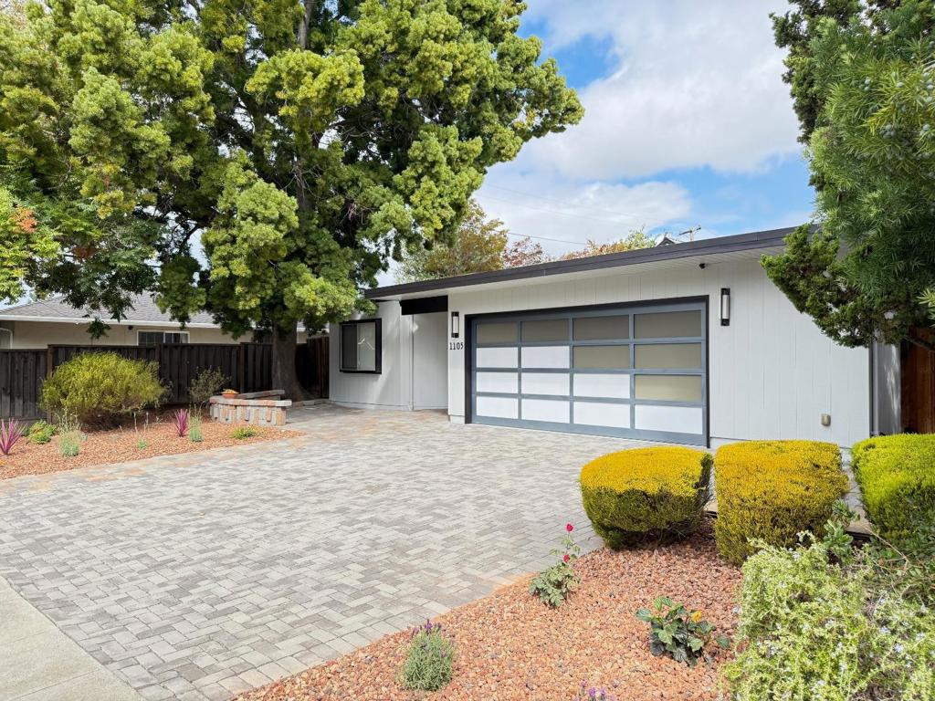 This beautifully maintained and thoughtfully customized Eichler home blends timeless mid-century modern architecture with contemporary comfort. The open floor plan creates a seamless flow between living, dining and kitchen spaces, perfect for entertaining and relaxing in style. Radiant heated floors provides cozy, energy-efficient comfort year round. The floor-to-ceiling glass panels bring the outdoors in and showcase view of the beautifully designed pool and spa. The custom-designed kitchen features abundant cabinetry with lots of pull out drawers/cabinets and a layout ideal for cooking and conversation. Two whole house fans ensure effortless climate control, enhancing the homes natural ventilation. This Eichler gem is more than a home, it is a lifestyle.