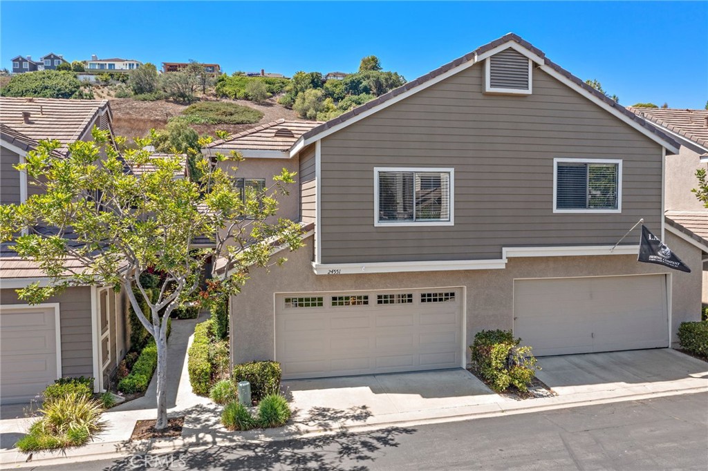 Coastal Charm Meets Modern Comfort in the Heart of Laguna Niguel! Welcome to a serene sanctuary in the highly desirable Camden Court community where thoughtful design, extensive upgrades, and a prime beach-close location come together in this beautiful attached single-family home. Ideally situated across from the pool/spa and just minutes from Salt Creek Beach, Ritz-Carlton, and Monarch Beach Golf Links, this inviting residence blends comfort, convenience, and coastal living. Step inside to a light-filled main level featuring soaring ceilings in the living room, a cozy brick fireplace, and an open-concept layout that flows effortlessly between the living area, dining space, and kitchen. A breakfast bar separates the dining area from the kitchen, offering casual seating for entertaining. The sliding glass door off the dining area opens to a landscaped backyard with hillside views-perfect for morning coffee, evening relaxation, or gatherings. The kitchen has been completely remodeled with brand-new soft-close cabinetry, quartz countertops, a pantry with pull-out drawers, stainless steel range and dishwasher, new sink, faucet, garbage disposal, and modern can lighting that adds both style and functionality. The main-floor powder room is fully upgraded with a new cabinet, mirror, lighting, toilet, and fixtures - adding convenience and charm for guests. Upstairs, all three bedrooms feature new luxury vinyl flooring. The spacious primary suite boasts vaulted ceilings, ceiling fan, view of the playground, large closet space and a beautifully remodeled en-suite bath with a custom walk-in shower, modern lighting, new mirrors, and toilet. The two secondary bedrooms offer privacy and comfort - one with neighborhood views and the other with hillside vistas, and share an upgraded full bathroom featuring a new tub/shower combo, countertop, mirror, lighting, and sleek fixtures. Additional highlights include a whole-house PEX repipe, new electrical panel, fresh interior paint, and newer AC and Heating systems. The home also offers stylish touches such as updated door handles and switch plates, keypad entry, new doorbell, and landscaped backyard. The attached two-car garage includes a full laundry area with storage shelves. Residents enjoy access to resort-style amenities including a sparkling pool, spa, playground, tennis court, basketball court, and nearby park. Low HOA fees and no Mello-Roos. This is a rare opportunity to enjoy the very best of coastal living! Must See!