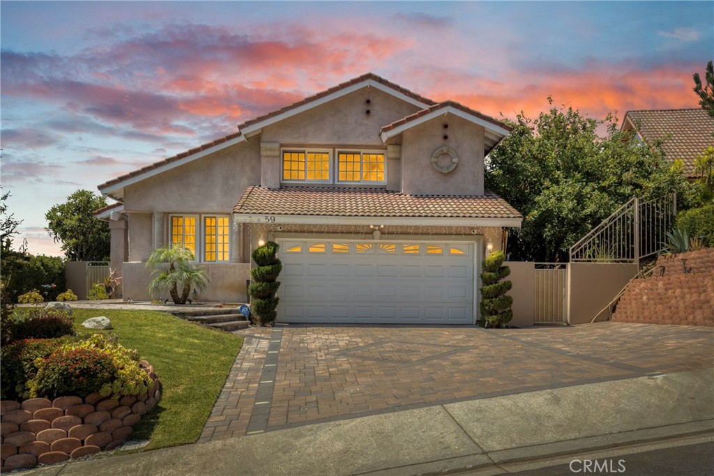 Stunning Hillside Retreat with City Light Views in Duarte
Welcome to this beautifully upgraded home nestled in the premium hills of Duarte, where comfort meets elegance and every detail is designed for elevated living. Set on an expansive 7,000+ sq ft lot, this 4-bedroom, 3-bathroom residence offers 1,925 sq ft of refined living space with breathtaking views of the city lights.
From the moment you arrive, the home impresses with its striking curb appeal, featuring a paved driveway and a spacious 2-car garage. Inside, a formal living and dining area set the tone for stylish entertaining, complemented by a custom-designed kitchen that effortlessly blends function and flair.
Just a few steps down, a cozy family room awaits—centered around a dramatic fireplace that adds warmth and character. The first level also includes a fully remodeled bathroom and a convenient guest bedroom—ideal for visiting guests or multi-generational living.
Upstairs, the primary suite offers a peaceful retreat with its own en-suite bathroom featuring a double vanity and soaking tub. . Also, on the second level you have another bedroom that features direct access to an upper deck balcony—perfect for taking in the sweeping city views. A fully renovated third bathroom and a bonus storage room complete the upper level.
Step outside and discover a true entertainer’s paradise. Multiple sliding doors lead you to a beautifully designed backyard oasis, featuring a covered patio, built-in BBQ, and a stunning pool with a waterfall, jacuzzi, and twin fire pits for added ambiance. A built-in fire pit on one side and a grilling station on the other make it perfect for year-round gatherings under the stars.
Additional features include central AC and heat, recessed lighting, double-pane windows, copper plumbing, rich hardwood flooring, and fresh interior paint throughout.
Don’t miss this rare opportunity to own a move-in-ready hillside home with endless charm, premium upgrades, and panoramic views in one of Duarte’s most sought-after locations.