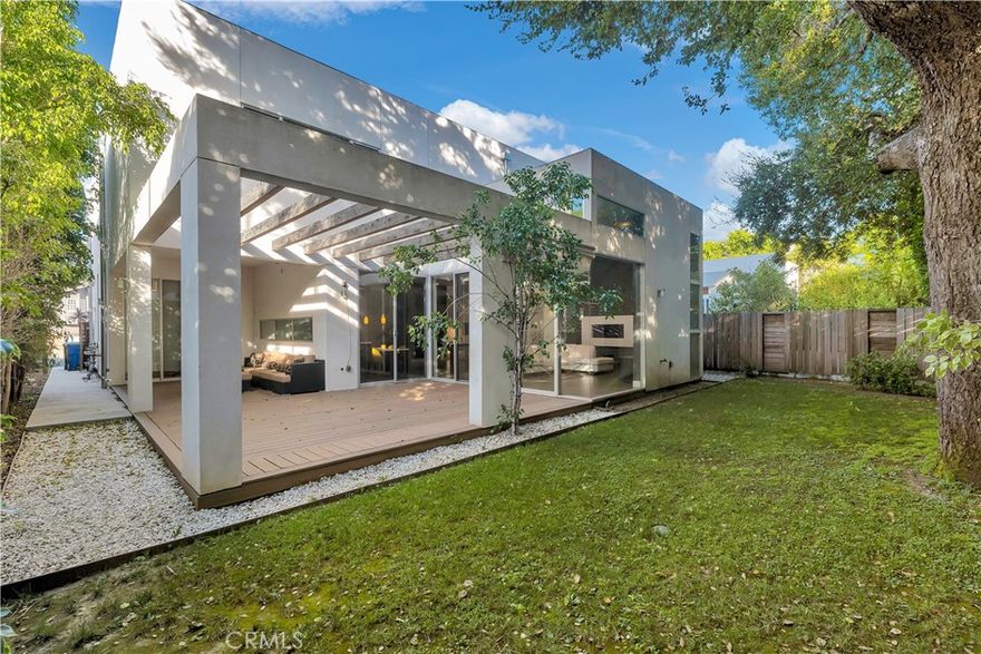 This elegant residential development of single family homes showcases the best of modern architectural design. Located on a peaceful Cul-De-Sac in the heart of Encino, this Modern Contemporary two story 4 bed, 4 1/2 bath offers approx. 3500 SF of luxury living w/ open floor plan, functional spaces & high end finishes - the best of So Cal living. Chef's kitchen w/ custom cabinetry, stainless apps & center island. Great room w/ soaring ceilings & fire place. Large en-suite bedroom, including master suite w/ custom closets, sophisticated master bath w/ dbl sinks & vanity. Large multi-purpose flex space w/ open loft like feel. Pre-wired for Crestron Automated Home System and solar panels. Indoor/outdoor living w/ over-sized patio accessible from entire first floor. Beautiful lush landscaping and stunning exterior Brazilian hardwood. Walking distance to restaurants, shops and parks.