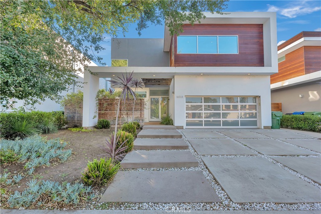 This elegant residential development of single family homes showcases the best of modern architectural design. Located on a peaceful Cul-De-Sac in the heart of Encino, this Modern Contemporary two story 4 bed, 4 1/2 bath offers approx. 3500 SF of luxury living w/ open floor plan, functional spaces & high end finishes - the best of So Cal living. Chef's kitchen w/ custom cabinetry, stainless apps & center island. Great room w/ soaring ceilings & fire place. Large en-suite bedroom, including master suite w/ custom closets, sophisticated master bath w/ dbl sinks & vanity. Large multi-purpose flex space w/ open loft like feel. Pre-wired for Crestron Automated Home System and solar panels. Indoor/outdoor living w/ over-sized patio accessible from entire first floor. Beautiful lush landscaping and stunning exterior Brazilian hardwood. Walking distance to restaurants, shops and parks.
