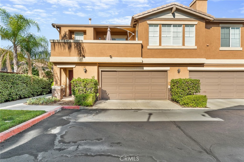 Welcome home to this highly desirable end-unit condo, ideally located at the end of a quiet cul-de-sac in the gated Villas at Old School House. Featuring 3 bedrooms and 2 bathrooms, this home is situated in a prime Murrieta location. At the top of the stairs, a versatile landing makes an ideal home office or study nook. The open-concept kitchen, dining, and living areas flow together seamlessly, highlighted by a cozy fireplace. A dedicated laundry room with storage and a utility sink adds everyday functionality. The spacious primary suite offers a walk-in closet and ensuite bath, while two secondary bedrooms and a full bath complete the layout. Step outside to the oversized balcony—perfect for relaxing or entertaining. Additional highlights include a whole house fan, plantation shutters, as well as a two-car garage with direct access and 220v outlet for EV charging. Residents enjoy access to the private community pool and spa, along with a convenient dog park located directly behind the building. The property also belongs to the highly rated Murrieta Valley Unified School District. Just minutes from shopping, dining, the 215/15 freeways, Murrieta Hot Springs, The Golf Club at Rancho California, and Temecula Wine Country. Don’t miss your chance to make this your new home!