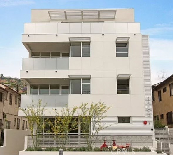 Located blocks from Beverly Center, La Cienega and the famed Sunset Strip with world class dining, shopping and entertainment. Built in 2009 eco friendly luxury units with attention to detail & master craftsmanship. Unit located at rear of building enjoy a quiet and peaceful atmosphere. No common wall. There are windows at every side of the unit, flooded with natural light. Each bedroom is ensuite, with a bathroom that is designer appointed with tub & shower. Formal dining room and living room features bamboo wood floors, recessed lighting, and ample closets and storage throughout. Open floor plan. Kitchen equipped with Cesar stone counter, Viking stove/oven(6 burners cooktop), microwave and built in cabinet. Breakfast bar with recessed lighting. Double pane windows. Central heating and air condition. Balcony has the view of the mountain. Pre-wired for cable & high speed internet access. Under ground tandem 2 parking spaces. Additional storage next to the unit. Total 7 units in the building. Freshly painted interior. Including washer/dryer/refrigerator/dishwasher. Full size stackable washer & dryer was installed Oct 2024.