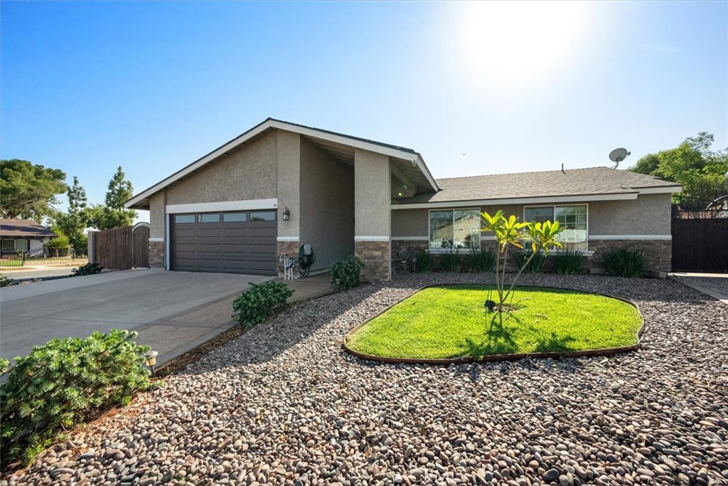 Solar Savings & Cul-de-Sac Comfort in Corona, CA! Nestled on a prime corner lot of a peaceful cul-de-sac, this 4-bedroom gem comes with 28 paid-off solar panels. Step inside and let the sunshine in, thanks to large windows and sliding glass doors. The kitchen features granite countertops, more cabinets than you’ll know what to do with, and enough space for all your secret recipes (or takeout menus, no judgment). Both the dining area and primary bedroom provide direct access to the backyard patio, ideal for relaxing, entertaining or cool off in the above-ground pool for the weekend!
Need a spot for your RV, hobby projects, or just a place to hide your holiday decorations? This property has RV parking and a large powered shed—because everyone needs a little extra space for life’s surprises, and also outdoors features low-maintenance landscaping, stacked stone accents, and stamped concrete details. Laundry is conveniently located in the garage, keeping things tidy and out of sight.
With no HOA, a low tax rate, and proximity to medical centers, freeways like 91 and 15, shopping, hiking, biking trails and more, this home delivers comfort, convenience, and a touch of fun. Welcome Home!