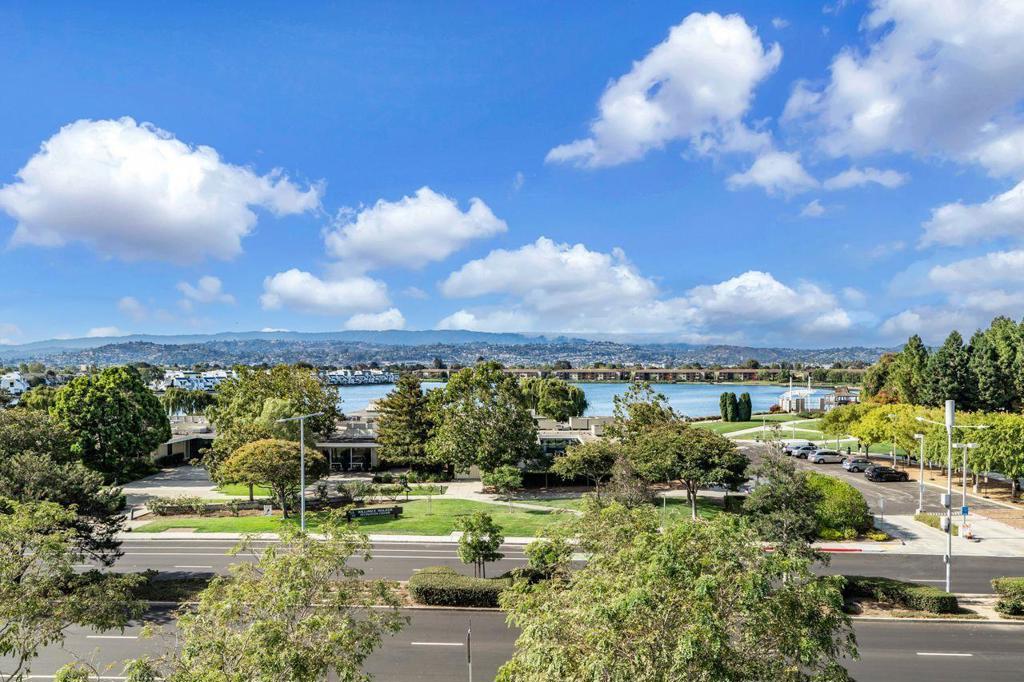 For rent this amazing rare opportunity. This is the best of Foster City Square. Come see this beautiful top floor, end-unit w/panoramic views Foster City. Don't miss your shot at one of the most sought-after units in this prestigious, luxury, modern, 55+ senior HOA community. Close to the library, PJCC, restaurants, markets, and shopping. Across the street from Leo Ryan Park, enjoy the outdoor amenities w/its recreation center, pickleball, bocce ball, amphitheater, lagoon activities, concerts, and paved pathways for an active lifestyle. Gorgeous 3bd/2ba unit of 1721 sq. ft. has high-soaring ceilings & large picture windows throughout, enhancing the great room kitchen/dining/living open floor plan, perfect for family and guests. Open chefs' kitchen has a large center island, SS appliances, ample wood cabinetry, walk-in pantry, beautiful tilework & countertops. The living area opens to the patio overlooking the park/lagoon. Upgrades galore, incl. engineered hardwood floors, LED recessed lighting, Hunter Douglas window coverings, walk-in closets, NEST-controlled central heat/AC & in-unit washer/dryer. Secure wheelchair accessible building has exclusive elevator access direct to the unit's private foyer. The spacious, private 2-car side-by-side garage is across from the elevator.