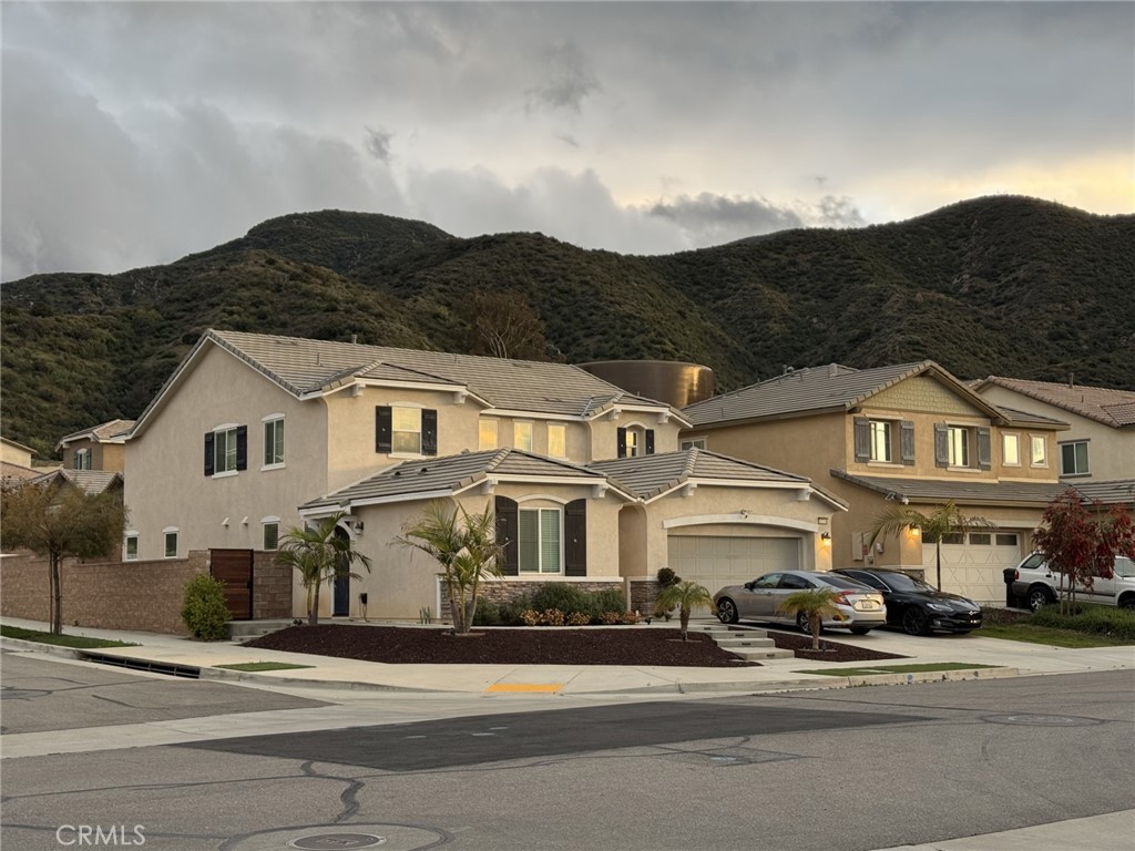 Stunning Sycamore Creek 4 bedroom 3.5 bath home with a main-level Next Gen mother-in-law suite featuring a private entrance, separate bedroom, full bath with ample living space, and its own refrigerator, washer, and dryer. The main 2 story open-concept main floor offers laminate flooring, an office, formal dining, and a spacious kitchen/family room. Upstairs includes a loft, laundry, three bedrooms, and a luxurious primary suite with spa-like bath, dual sinks, and large walk-in closet. Enjoy a wet bar with beer/wine fridge, backyard with built-in BBQ, fire pit, custom exterior gate, exterior lighting, solar panels, and 3-car garage with epoxy flooring and storage. Washer, dryer, and refrigerator in main home also included. Sycamore Creek offering new pickleball courts, new BMX bike park, Skate Park, Dog Park, Soccer & Baseball Fields, Tennis & Basketball Courts, BBQs & Picnic Areas! Sycamore Creek residents enjoy close proximity to shopping, dining, golf courses, hiking trails, nearby 15 freeway access, and great schools.