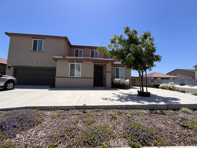 This is a spacious, family-friendly home with a large kitchen featuring an island and stainless steel appliances. The kitchen is open to sizable eating area
with access to the outside, and it overlooks the family room. The home also offers a bedroom and a full bathroom on the ground floor, conveniently located near the family room. This home boast 5 bedrooms and 3.5 bathrooms. Upstairs, you'll find a large Master bedroom with a spacious walk- in closet, along with three additional bedrooms and full bathroom.There is also an upstairs family room, perfect for entertainment or relaxation.
The inside laundry area includes nice counters and plenty of storage.The backyard features a large covered patio, grassy area with planters for flowers or fruit trees, and additional side parking.The home is near a community park, ideal for walking and leisure. Solar panels are included.