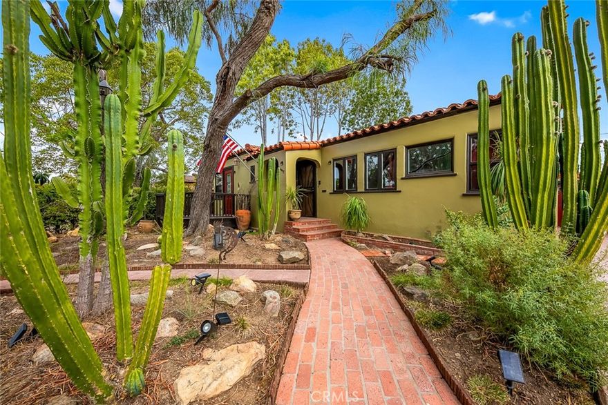 Enchanting El Cerrito Retreat! Beautifully remodeled 2BR/1BA home featuring wood floors, gas fireplace, stained-glass windows, and large custom shower. New kitchen with quartz countertops, new cabinets, gas stove, dishwasher, and stacked washer/dryer hookups. Mini-split heat/AC, Spanish tile roof, new 4" sewer line, and seller-owned solar. Enjoy an additional 240 sq.ft. enclosed patio overlooking a spacious 6,400 sq. ft. yard—perfect for entertaining or relaxing. Drywalled one car garage with water and electricity. Backyard includes Jacuzzi and storage shed w/ space to add a pool, units, or expansion of home. Walk Score 80, Transit+Bike 55 - minutes from San Diego State University, convenient freeway access, short walk to public transportation. Just four houses from The Living Room Coffeehouse in the Heart of the Charming El Cerrito neighborhood!