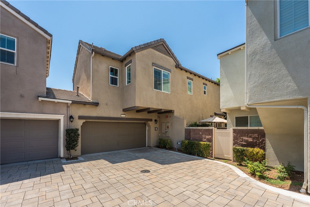 Nestled in the Preserve's Harvest neighborhood, this modern condo, built in 2018, offers a comfortable and stylish retreat. Spanning 1,579 sq ft, this home features 3 bedrooms and 2.5 baths, with a 2 car attached garage adding everyday convenience. Step inside to discover an open layout creating a warm and inviting atmosphere from new paint to new floors, quartz countertops, enormous island, and large pantry. Upstairs you will find well sized bedrooms filled with natural light. The primary suite offers the perfect place to unwind. The home is equipped with Central air and heating, making it comfortable year round. Step outside the sliding glass door into a professionally, beautifully designed backyard retreat. The covered patio offers the perfect spot to relax or entertain and the motorized screen system transforms the space into a cozy, screened-in porch at the touch of a button. Ideal for enjoying fresh air without the bugs. Living here means enjoying the many benefits of the Preserve lifestyle, well maintained grounds, community amenities, and a secure gated entrances. The only gated community in the Preserve. You are located within the highly rated Chino Valley School District, close to shopping, dining, and freeway access. Whether you’re a first time buyer or searching for an investment property 8705 Celebration Street is move in ready and waiting to make it your own.