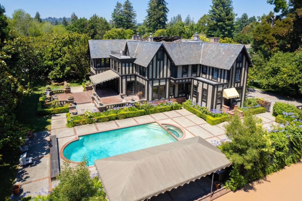 RARE HISTORIC GEM, UPDATED FOR A MODERN LIFESTYLE! 1.42+ ACRES OF ALL FLAT LAND IN PRIME LOWER HILLSBOROUGH. Here you'll find a regulation tennis court, sprawling grass lawns, park-like fields / playgrounds, a sparkling solar-heated swimming pool, manicured gardens, & MORE! You can experience the epitome of timeless character and modern luxury in this one-of-a-kind English Tudor-style mansion nestled in the coveted Brewer Subdivision/Upland neighborhood, one of Hillsborough's most sought after areas. Old world charm suited for modern conveniences! MANY UPDATED AREAS THROUGHOUT. The grand foyer welcomes with antique oak floors and intricate crown molding, leading to sunlit rooms and multiple fireplaces. A recently refreshed interior features a kitchen blending old-world charm with high-end stainless steel appliances and leaded glass windows. Upstairs, the luxurious master suite offers a private sitting room or office, complemented by individually designed bedrooms and updated bathrooms. Inside you'll find 6 EN-SUITE BEDROOMS, perfect for hosting friends & family. Enjoy the convenience of being near downtown San Mateo and Burlingame, countless top schools, and a tranquil cul-de-sac setting, epitomizing the BEST HILLSBOROUGH HAS TO OFFER! This is one you'll want to see in person.