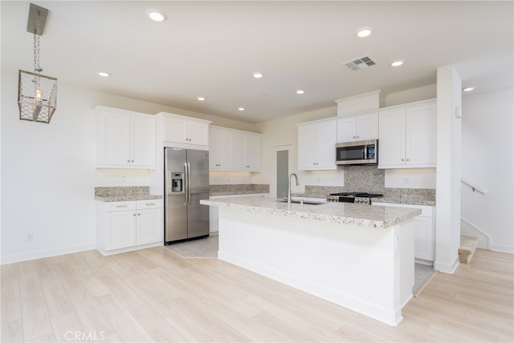 This gorgeous, newer built home construction home is available for IMMEDIATE 1 YEAR LEASE for September 1st move in or sooner. This attached condominium (NOONE BELOW OR ABOVE YOU!) offers 3 floors of spacious living and tall ceilings. The first floor is your main floor bedroom with adjacent full bath with standalone walk-in shower. On the second level, you'll find the gorgeous kitchen with plenty of cabinet space, soft closed drawers, granite countertops, NEWER stainless-steel appliances, gas range and a walk-in pantry. The kitchen looks out to the dining area, living room and balcony with MOUNTAIN & PARK Views. Lots of sunshine pours through this end unit home. The half bathroom on the second floor finishes off this level. On the third floor, you'll find your additional 2 Bedrooms. All bedrooms have carpet. Your Primary Suite is complete with more mountain and park views, generous size Walk-in Closet, dual vanities, and walk-in shower. The secondary bedroom has an ensuite bathroom with a shower tub combination. Conveniently located on the 3rd floor is your laundry closet with NEW stackable LG Washer & Dryer (Not pictured) and extra cabinet and shelf space in the hallway. 2 Car attached garage- no driveway but there's ample street parking. This community offers resort style amenities with pool, spa, clubhouse, playgrounds, parks and BBQ areas are all included in your Rental at no extra charge. NEWER Blinds & Washer/Dryer are being installed this week. Pets are welcome on a case-by-case scenario. Make sure to check out the 3D Virtual Tour.