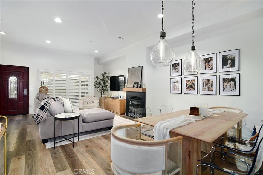 Looking to make a dazzling upgrade to your current living situation? You've hit the jackpot w/this rear of the complex located Sherman Falls townhome! 2 BEDROOMS + BONUS ROOM. Walk in & you're greeted by high ceilings, upgraded wide plank Oak style flooring, recessed LED lighting & a dazzling gas fireplace. A mesmerizing kitchen affords you a grand sized center-island w/QUARTZ counters, newer high-end stainless appliances, spacious pantry & real wood cabinets w/soft close drawers. Conveniently located HALF BATH downstairs featuring a concrete vanity & Kohler fixtures. Venture upstairs to discover DUAL MASTER SUITES & a spacious laundry room with SIDE by SIDE washer & dryer! The smaller suite still offers plenty of space and the same high ceilings and recessed lighting from downstairs. In addition, a spacious closet w/built-ins, wainscoting accent wall, oversized bathroom barn door, double pane windows and beautiful plantation shutters. The en-suite bath features a Kohler soaking tub & fixtures, custom glass shower door, imported Spanish hexagon tile & marvelous wall mounted floating concrete sink. The true MASTER SUITE is magazine worthy! Rejuvenating ceiling fan, a glass slider to a Juliette balcony, reclaimed wood barn door and more. The bathroom offers a skylight, 8' walk-in completely custom shower w/dual shower heads w/separate controls & linear drain. In addition, floor to ceiling tile, frameless shower panels, double vanity sinks offering wall mounted Kohler fixtures and Restoration Hardware pendant lights! Finally, make your way downstairs to discover 2 SIDE BY SIDE parking spaces w/direct access to the garage, a dedicated TESLA charger just for your unit, in addition to a spacious BONUS ROOM off the garage, perfect for a home office, gym, guest room, storage, etc.