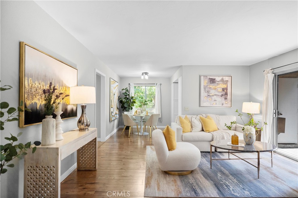 Move-in ready 2-bedroom, 2-bathroom upper-level end-unit condo in the gated community of Fashion Heights, La Habra. This beautifully upgraded unit features a slate-tiled entry, cozy living room with built-in gas fireplace, and a private patio with pool views—perfect for BBQs and extra storage. The spacious master suite offers ample closet space and a private bathroom. The HOA covers water, trash, and gas, so the owner only pays for electricity. Conveniently located within walking distance to shopping centers, restaurants, grocery stores, Walmart, Lowe’s, Sam’s Club, LA Fitness, a movie theater, and more. Includes a 2-car detached garage. A quiet, well-maintained community ideal for comfortable living.