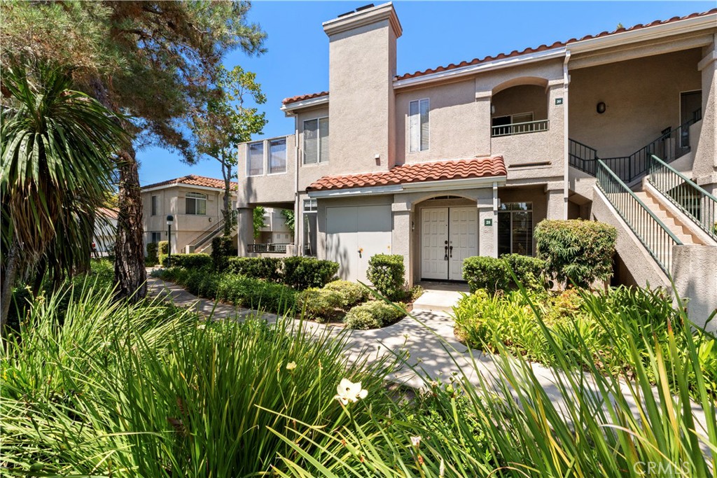 Welcome to this Dual-Primary 2 Bed / 2 Bath Condo in the Heart of Aliso Viejo
Don’t miss this incredible opportunity to own a beautifully maintained 2-bedroom, 2-bathroom dual-primary condo in one of Aliso Viejo’s most sought-after communities! From the moment you walk through the front door, you’re welcomed by a bright and open living space featuring a fireplace and seamlessly flows into the well-appointed kitchen—ideal for both everyday living and entertaining.
To the right of the living room, a spacious primary suite offers a private retreat complete with a full en-suite bath. To the left you'll find your private balcony—perfect for morning coffee or evening relaxation. Just off the kitchen is a dedicated laundry room, and just past the laundry room you'll find the second generously sized primary suite, also featuring a full en-suite bathroom for maximum comfort and privacy.
This home also includes a detached one-car garage, a designated parking space, and access to resort-style amenities, including two pools and a fully equipped fitness center.
Located just minutes from shopping, dining, grocery stores, top-rated schools, and with a beautiful park directly across the street, this home offers the perfect blend of comfort, convenience, and community living!