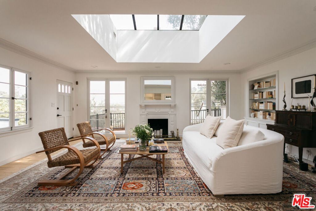 Perched above the street, this cozy Laurel Canyon remodel has expansive treetop views and a detached writer's studio / home office, giving the property a compound-like feel. Main level of living, dining, kitchen with breakfast nook and guest bedroom / bath has pyramid skylights to keep the spaces bathed in sun (and moon) light. The main level opens to a verdant dining / living patio with built-in seating and a fire pit. Stairs lead to the recently restored writer's cabin with loft. Additionally, there is a hot tub with views. Lower level there are two bedrooms, including the primary suite with custom bath with designer finishes and a walk-in closet. Also includes: laundry room, climate controlled wine cellar and a 1-car garage. Wonderland School District! UNFURNISHED LEASE.