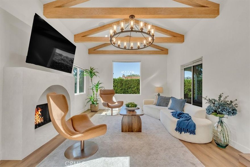 Embodying effortless coastal living, this beautifully reimagined corner-lot residence sits just moments from the sand in one of Santa Monica’s most coveted beachside enclaves. Enclosed by lush privacy hedges and surrounded by mature trees, the property offers tranquil outdoor spaces with an inviting front terrace and manicured lawn—all kissed by refreshing ocean breezes. Inside, sun-filled interiors reveal a sophisticated single-level layout with clean lines, wide-plank wood flooring, and expansive picture windows that frame natural light and greenery. The open main living area flows seamlessly into a contemporary chef’s kitchen and dining space—crafted for elevated daily living and effortless entertaining. The tranquil primary suite features a spa-inspired bathroom, while the property’s versatility is enhanced by a private detached casita—ideal for a luxurious guest retreat or creative workspace. Situated within one of Santa Monica’s most desirable enclaves, residents enjoy proximity to Montana Avenue’s boutique shopping and cafés, the beach path, Rustic Canyon Park, and the Brentwood Country Mart. This residence masterfully blends privacy, modern design, and the timeless allure of the Santa Monica coastal lifestyle.