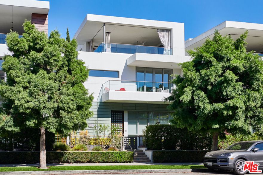 The Crown Jewel Of Playa Vista.  Welcome to 5904 Village, formerly a Jewel Model residence, in the heart of Silicon Beach. The main level offers an open concept design where the great room flows effortlessly into the chef's kitchen, dining area, and tranquil outdoor retreat. A private en-suite bedroom on this floor is ideal for guests or multi-generational living.Upstairs, discover three spacious bedrooms along with a comfortable lounge area. The primary suite impresses with a huge walk-in closet, private deck, and spa-like marble bath featuring dual vanities, a walk-in shower, and a freestanding soaking tub.The third level is designed for entertaining with a bright loft, a stylish home office, and a fully equipped bar. From here, sliding doors open to an expansive covered deck with a beverage center and TV, perfect for gatherings, game days, or simply watching the sunset. Additional highlights include a two-car garage, dedicated guest parking spot and access to all of Playa Vista's premier amenities. Fully upgraded and thoughtfully designed, this Jewel Model home delivers the absolute best of Playa Vista living.