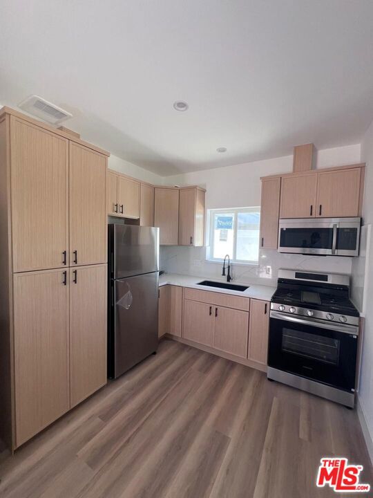 350 sqft Junior ADU, Shared with two other Units. perfect for in-laws or family, a cozy retreat single w/full kitchen, bathroom, laundry and separate entrance! Every detail has been thoughtfully curated, from the quartz countertops to the designer-quality fixtures and bathroom tiles. As you explore the ADU, you'll be greeted by the same level of quality and craftsmanship. With its own entrance and amenities, this newly constructed dwelling offers privacy and comfort, ideal for guests, extended family.
