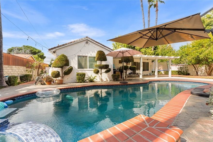 Welcome to your new oasis!



This charming and beautifully maintained 4-bedroom, 2-bath single-family home offers 1,382 sq. ft. of comfortable living space on a generous 7,249 sq. ft. lot.



From the moment you arrive, you'll be greeted by a gated entry and a beautifully landscaped walkway surrounded by lush greenery and vibrant blooms. Once inside the double doors a bright and inviting interior featuring white tile flooring, recessed lighting, and fresh, modern paint throughout.



The updated kitchen shines with sleek stainless steel appliances and plenty of counter space, offering the perfect blend of style and functionality. Both bathrooms have been tastefully upgraded with clean, modern finishes.



Out back, enjoy your very own private retreat, complete with a sparkling pool, relaxing hot tub, and a covered patio ideal for entertaining or soaking in those warm California evenings. A spacious two-car garage adds convenience and ample storage.



This home perfectly balances comfort, privacy, and outdoor enjoyment, ready for its next owner to make lasting memories.