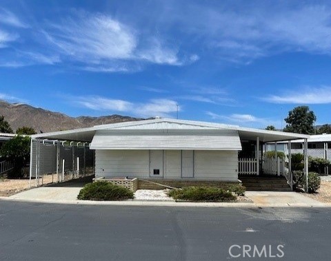 Discover the potential of this LAKE FRONT 2-bedroom, 2-bathroom home nestled in a desirable 55+ community. This home offers a perfect canvas for those looking to infuse their personal style through cosmetic updates. This home features a large living area, spacious bedrooms, the master bath comes with a soaking tub, double sinks and a separate vanity. The kitchen, open to the family room is ready for a refresh to become the focal point of the home. Located across the street you will find the popular Soboba Casino, championship golf course and plenty of restaurants to choose from. Join in on the fun activities and events sponsored by the resident’s association. This property is a fantastic opportunity for those looking to customize their next home in a supportive and active senior community