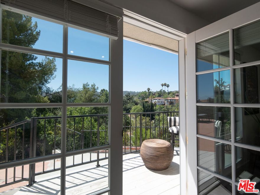 New Price for this South of the Blvd lovely home. You'll fall in love with the view as you open the front door. Comfortable one story living. Tastefully remodeled, with 4 bedroom and 3 bath. Close to 3,000 square feet of the building on a large lot. Among this home's features are engineered custom wood flooring and stone floor in the kitchen, energy efficient windows, central heat and cooling system. Kitchen with custom cabinets, quartz counter tops, recessed lighting and a large island. Sit by the newly redone pool, enjoy the peaceful serene atmosphere and the beauty of the view. A wide driveway, two car garage plus extra parking spaces all are located inside the private gate. Desirable neighborhood, access to the best schools and nearby Kicking path. Just minutes from Westfield Village, Woodland Hills Country Club, Serrania Park, Whole Foods and trendy stores. This home perfectly fuses luxury and convenience, redefining suburban living. Schedule your showing today!