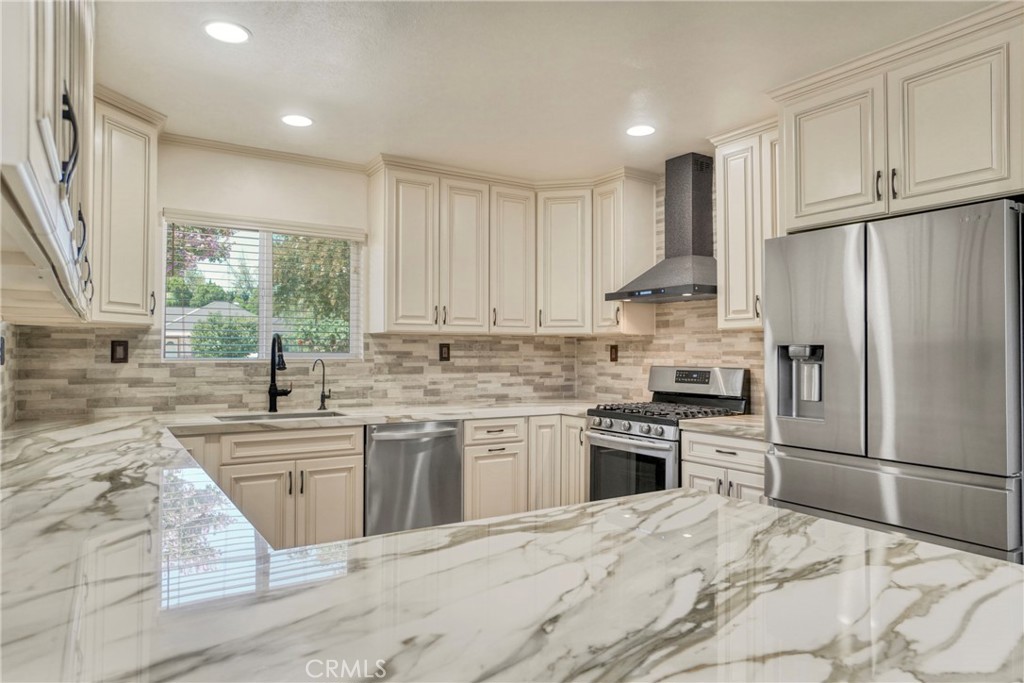 This charming home in West Hills with Vaulted Ceilings throughout, has been completely renovated and is move-in ready. With 3 bedrooms and 3 bathrooms spread across 1,771 square feet, it offers a spacious, open floor plan with high ceilings and recessed lighting throughout. The gourmet kitchen features sleek Calacatta porcelain countertops, stylish soft-close cabinetry, and stainless steel appliances, making it perfect for both everyday living and entertaining.
The home includes two primary suites, each with its own private bathroom, plus a third bedroom. The washer and dryer are conveniently in the hallway. The spacious backyard is ideal for outdoor gatherings or relaxation and the 2-car garage provides plenty of storage.
Located near parks, schools, shopping, and dining, this home blends modern upgrades with comfort and convenience. Don’t miss your chance to see it—schedule a showing today!