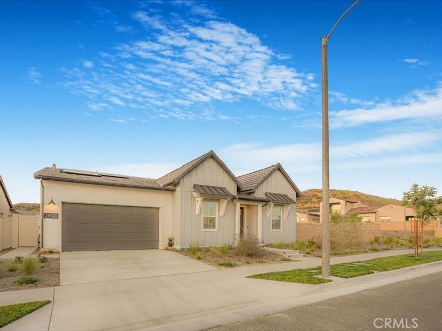 One-of-a-Kind Resort-Style Home on Rare Dual-Parcel Lot in Gated 55+ Community! Welcome to 24501 Via Sendero, a

stunning 2024-built residence located on a massive corner lot with two separate APNs (3244-161-036 & 3244-161-037)

in the highly desirable Estrada 3 at Tesoro Highlands Valencia community. This is one of the few homes offering such an

expansive lot, delivering privacy, space, and exceptional value. Experience elegant resort-style living in this immaculate

3-bedroom + office, 3.5-bathroom home with approximately 2,550 sq ft of open-concept luxury. Step inside to find

premium vinyl wood flooring, soaring high ceilings, and a thoughtfully designed layout ideal for comfort and

entertaining. The custom 4-panel sliding glass doors seamlessly connect indoor and outdoor living spaces. The chef’s

kitchen is a showstopper—equipped with a 6-burner gas range and built-in griddle, stainless steel appliances, a spacious

island with seating, modern countertops, designer backsplash, a dry bar, and abundant cabinetry. A walk-in pantry with

custom wood shelving and a large laundry room with ample storage add everyday convenience. Retreat to the luxurious

primary suite with direct patio access, a generous walk-in closet, and spacious bathroom ensuite featuring dual sinks

and a large walk-in shower with bench seating. All the 3 bedrooms feature ceiling fans with light fixtures for year-round

comfort. Enjoy California living at its best in the resort-style backyard with low maintenance paved backyard- ideal for

entertaining family and friends. Additional highlights include: Owned solar panels with a capacity of 10 Watts Tesla

Battery Central A/C & heating Tankless water heater EV charger 2-car attached garage with direct access Designer

lighting & chandeliers throughout. OPEN HOUSE FRIDAY, 9/5 BETWEEN 2-5 PM Enjoy premier 55+ gated living with

clubhouse access, recreational facilities, fitness center, swimming pools & spa, pickleball courts, dog park, and a full

calendar of lifestyle events and social activities are located right behind the house at a walking distance. Don’t miss this

rare opportunity to own a modern, move-in ready home with unmatched space and amenities in one of Valencia’s finest

active adult communities. Truly a place to call home.

EXCLUSIONS: INC