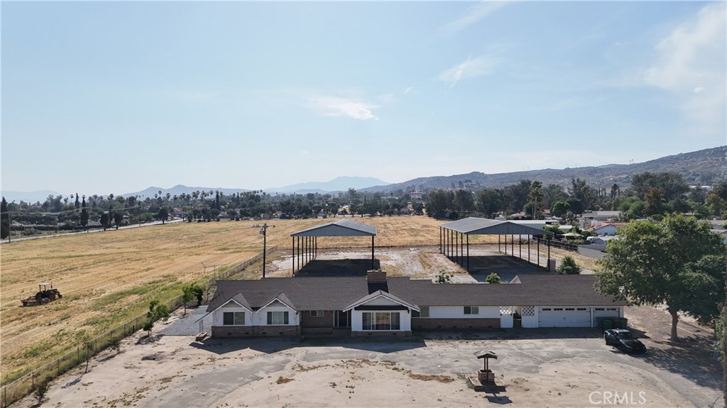 Incredible opportunity to own 18+ acres flat, usable acres in the growing community of Nuevo- Ideal for those seeking a private retreat with future building potential. Zoned CR (Commercial, Residential) . Nestled at the end of a quiet culdesac, the property features a well maintained 4 bedroom, 3 bathroom home with peaceful views of the surrounding hills and open skies. Enjoy the tranquility of rural living with room for horses, farming, or outdoor recreation, all while being just minutes away from Menifee, Perris (Lake Perris), and Highway 74. Whether you're looking to build upon or live surrounded by wide open space, this unique property offers the best of all worlds. FULLY REMODELED and contains city water use and a well. Buyers to do their own due diligence regarding building potential.