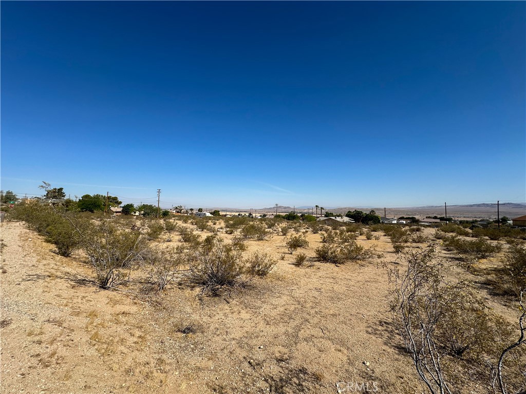 Nestled in one of Barstow’s most desirable neighborhoods, this ±2.5-acre corner lot (APN: 0427-311-13) at Brucite Avenue and N Street offers a rare opportunity to build a custom home in the highly regarded Heights area. Zoned for low-density residential use (1 dwelling unit per acre), the lot is ideal for those seeking space, privacy, and the freedom to design an estate-style residence. The level terrain and paved street frontage provide a strong foundation for development, with utilities nearby to streamline your build. Surrounded by quality homes and offering potential for sweeping desert views, this parcel combines peaceful living with long-term investment value. A standout homesite in one of Barstow’s most exclusive enclaves.