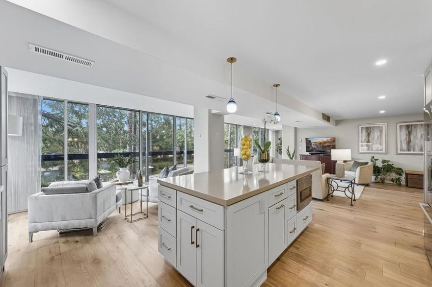 Introducing 101 Alma Street, Unit 207, an impeccably remodeled 3 bed, 2 1/2 bath condominium offering refined living in the heart of downtown Palo Alto. The kitchen renovation reimagined the home's design, creating an expansive open-concept great room where the kitchen, dining and living spaces flow seamlessly together. Floor-to ceiling windows with commercial double pained glass  windows and sliding doors showcase sweeping views of the western hills and Stanford University. With its timeless finishes and effortless blend of sophistication and comfort, this home provides a rare opportunity to experience living just moments from word-class dining, shopping and Stanford University.