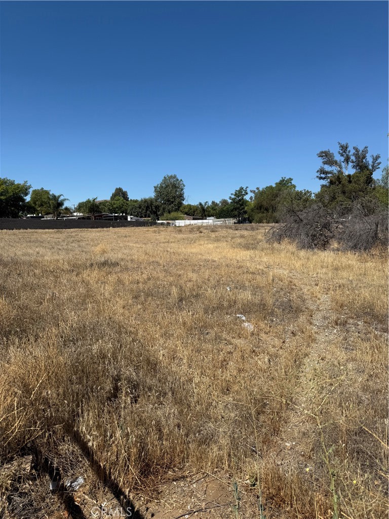 An excellent opportunity to own 2.05 acres of flat, usable land in the growing city of Perris! This property is located in a highly desirable area, just under 5 minutes from key amenities including Walmart, Lowe’s, Wells Fargo Bank, gas stations,Fwy 215,91,15, many restaurants such as Del Taco, Panda Express,Chili's, and more.... The property had a 2-bedroom, 1-bathroom mobile home, which has been removed, leaving a cleared and ready-to-build lot. Perfect for building your custom home or placing a new manufactured home. Great investment or future development land. Whether you're an investor, builder, or homeowner looking to settle in a convenient and fast-growing area, this property has great potential. Motivated Seller – Priced to Sell!