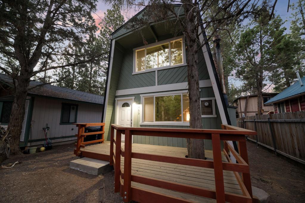 Nicely Remodeled Gambrel on the Quiet Side of Town. This cute cabin has been gone over with a loving hand. New roof, exterior paint and redone deck. Inside boasts new laminate flooring, redone kitchen and bathroom with fresh paint and a new water heater. New vanity and tile and fixtures in the bathroom. High beamed wood ceilings. Good sized bedrooms. Close to the national forest and trails. Great price on a great cabin.