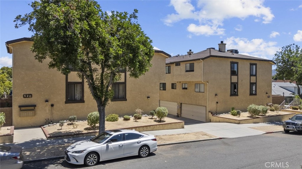 Remodeled Corner Tri-Level Townhouse North of Glenoaks! This beautifully updated home welcomes you with a spacious front patio - ideal for relaxing or entertaining. Step through the double doors into a bright and airy great room featuring oversized windows that flood the space with natural light and a cozy fireplace. The adjacent remodeled kitchen is equipped with quartz countertops, soft-closing cabinets, a newer range, brand-new dishwasher, and a reverse osmosis water system. A coat closet and a remodeled powder room with quartz countertops complete the main level. Upstairs, the expansive primary suite offers two walk-in closets and large windows with beautiful views and abundant light. The en-suite bathroom includes a shower/tub combo. A linen closet is conveniently located just outside the room. Two additional well-sized bedrooms also feature generous natural light and share a remodeled full bathroom that includes a shower/tub combo. The lower level offers a versatile bonus room perfect for a home office or gym, with a dedicated laundry area (gas and water hookups) and direct garage access. Additional highlights include: ample storage throughout, newer laminate flooring, and a prime location near the I-5 freeway, restaurants, shops, Bob Hope Airport, and Joaquin Miller Elementary School.