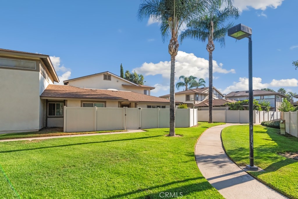Welcome to this charming single story, end-unit home in the desirable gated community of Charter Village Green. Enjoy the privacy of a gated front patio with low-maintenance artificial turf, perfect for relaxing or entertaining. Inside, you’ll find a spacious living room with wood shutters on the windows, an open kitchen and dining area, and a dedicated laundry room. The well-sized bedrooms include a primary suite with an en suite bathroom. Additional highlights include a direct-access garage and thoughtfully designed floorplan. The beautifully maintained Charter Village Green grounds feature gated access, lush landscaping, and a sparkling pool with lounging areas, making every day feel like resort living. Located in a prime area near schools, markets, and dining options, this home combines modern amenities with an unbeatable location.