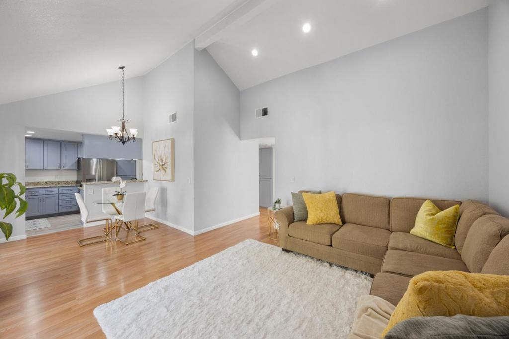 Don't miss this unique chance! Explore the desirable upper unit in the peaceful, gated Summerton Community. This rare find boasts a private entry in a tranquil courtyard, with lovely views of a pond, fountain, and redwood tree. This updated 2-bedroom, 1-bathroom unit is 953 SF and features fresh paint, quality upgrades, and high-end finishes. The modern kitchen includes quartz countertops, new recessed lighting, stylish fixtures, a breakfast bar, and newer appliances. The open layout showcases vaulted ceilings and a cozy fireplace. A large sliding door opens to a spacious patio with extra storage. The primary bedroom features a vaulted ceiling, a walk-in closet. Additional perks include an in-unit laundry room with washer and dryer, central A/C and heating, and 2 private parking spaces (1 covered, 1 open). Enjoy resort-style amenities in a prime location near Grand Century Mall and Costco, with easy freeway access (101/280/680) to Downtown San Jose and major tech companies. This quiet, gated community offers privacy and features tennis courts, a swimming pool, green belts, trails, and ponds. The HOA fee covers water/sewer, trash, common area maintenance, master insurance, basic TV cable, and internet. Come see what makes this home special, won't last long!