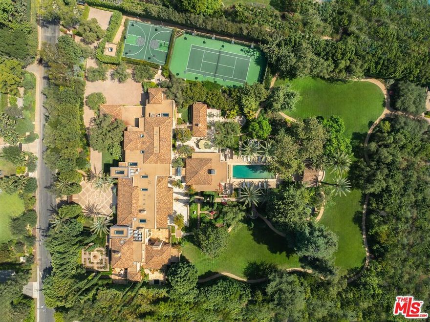 3.5 acres completely flat makes this one of the most important estates in Los Angeles. Mallorcan Villa designed by renowned architect Bob Ray Offenhauser and built by Peter McCoy Construction. Timeless and Elegant, seamless blend between interior and exterior spaces. The Villa is in pristine condition with exquisite detail, extensive use of imported stone and exceptional steel windows/doors by Architectural Iron Works. Soaring 20ft coffered ceilings in the living room. 2-story dining room and library are perfect backdrop for grand entertaining. Indoor-outdoor pavilion/bar overlooks the infinity edge pool and pool cabana. Primary suite is a world apart with views over vast lawns, reminiscent of Montecito. Double baths with individual pocket gardens. Additionally, there is a large guest suite, 4 generous family bedrooms each with homework areas, a junior guest room and staff bedroom. Totaling 8 bedrooms. Additional features of the estate include: gourmet kitchen and catering kitchen, large gym, 1,200 bottle wine cellar, game room, oversized 4-car garage, and a service building with separate entrance. Gardens designed by Todd Bennitt. The grounds feature: rolling meadows, olive allee, formal rose gardens, courtyards, water features, tennis court and sports court. All in complete privacy. A work of art to be cherished and celebrated. Shown only to prequalified buyers.