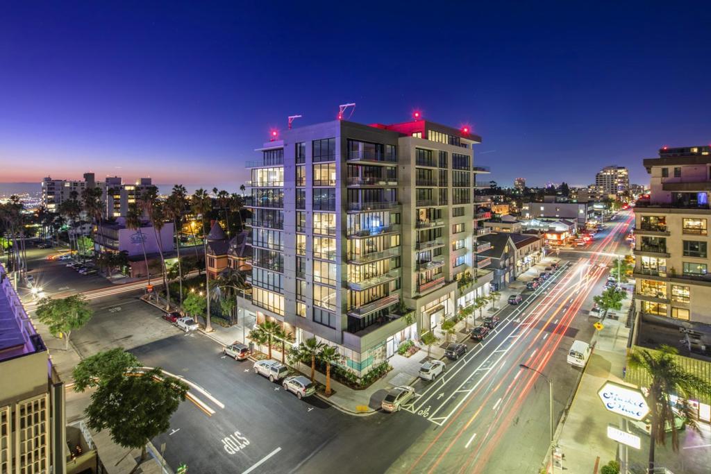 Step into this stunning southwest-facing third-floor residence at 41West, bathed in natural light and offering the perfect blend of sophistication and comfort. A floor-to-ceiling retractable NanaWall opens to a sprawling 200-square-foot West facing terrace, showcasing views of Point Loma, the bay, and the surrounding neighborhood. See Supplement Inside, soaring 10-foot ceilings create a sense of spaciousness, while high-end finishes complete the luxurious atmosphere. The chef’s kitchen features Miele appliances, sleek Italian cabinetry, a gas cooktop, and a wine chiller. The expansive primary suite includes a spa-inspired en-suite bathroom with modern fixtures, a soaking tub, and a separate walk-in shower. The second bedroom is also generously sized and offers direct access to the terrace, ideal for guests or a home office.