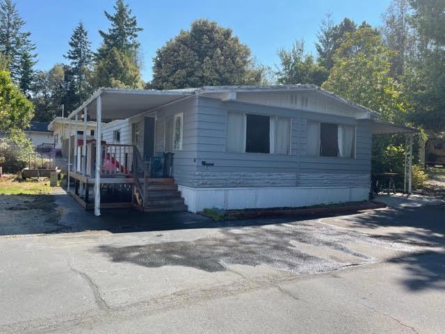 This spacious 1,488 sf double wide mobile home with 2 bedrooms and 2 bathrooms borders on a large open area and is at the end of a quiet cul-de-sac. Madrone Mobile Home Park is in "sunny" Hiouchi with its temperate climate. It's a little hamlet surrounded by national and state forests at the beautiful Smith River known for its fishing, swimming and kayaking. It is only 11 miles from Crescent City, the seat of Del Norte County and the Pacific Ocean.