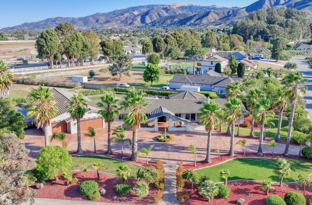 On the largest, most desirable lot in this exclusive community, this sprawling 1.91-acre corner property offers privacy and potential. At its heart sits a remodeled 3,120 sq ft residence with 3 bedrooms, 2.5 bathrooms, and a dedicated office. The interior is a showcase of high-end design, with new engineered oak floors flowing throughout. The gourmet kitchen is a showpiece, featuring quartz slab countertops, new maple cabinets, and a suite of new stainless steel appliances. The owner's suite is a sanctuary with a fireplace, custom walk-in California Closet, and spa-like bathroom with quartz countertops and a steam shower. The luxury extends outdoors to a backyard resort for entertaining, featuring an expansive covered patio, spacious gazebo, fully fenced pool with a recently replaced heater, and a hot tub. Car enthusiasts and hobbyists will appreciate the immense 6-car drive thru garage with newly installed doors. The grounds also offer potential to build a full-sized ADU for guests or rental income. Peace of mind is assured with system upgrades, including a new furnace, whole-house generator, and smart thermostats. This is a rare opportunity to acquire a spectacular, turnkey home on a legacy property in a sought-after school district.