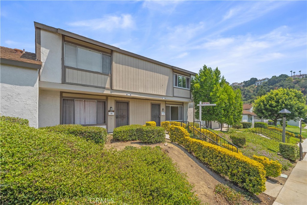 Welcome to this beautifully 2-story condo featuring 3 bedrooms and 2 bathrooms , ideally situated in a highly sough-after neighborhood. Walking distance to award-winning Diamond High and Evergreen Elementary. The bright and airy living room opens to a private outdoor patio, perfect for relaxing or entertaining. new interior painting ,brand-new switches and outlets through out the house, Especially convenient dual-control light switches-turn the lights off right from your bed without getting up . Recently upgraded for comfort and peace of mind! Entire water supply system,water heater and car garage door replaced within 2 years . Naturally cool and breezy—only needed AC for 3–5 nights this summer! the Spacious primary bedroom offers a walk-inclose and wood flooring runs throughout the home for a warm and modern feel. the detached 2-car garage comes with built-in storage shelves. Community amenities include a sparkling pool,SPA and BBQ area . Surrounded by lush greenery and landscaped walkways , the community feels like a serene retreat nestled in the hills , true to its address name. conveniently located near major shopping centers such as Albertsons, Walmart and H-mart with easy access to the 60 and 57 freeways. Experience comfort, convenience, and an unbeatable location , this home is ready for you to move