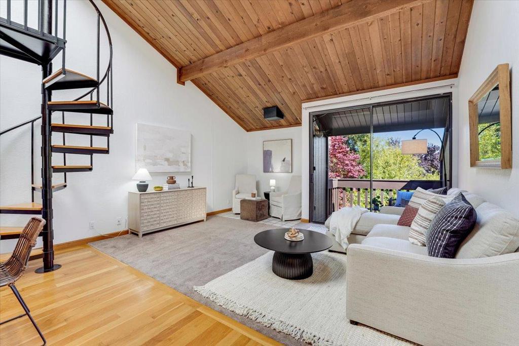 Escape into nature in the sought-after Shelter Lagoon community, surrounded by the tranquil waters, flourishing vegetation and abundant wildlife of Neary Lagoon! Explore its floating docks while enjoying the diversity of this urban wetland. Conveniently located within walking distance of beaches, surfing, Beach Boardwalk, playgrounds, downtown & West Cliff paths. UCSC and commuter access just minutes away. This home is tucked away in a quiet corner of Shelter Lagoon. A reverse floor plan maximizes the bright, open feel of the home and showcases a loft accessed by a spiral staircase perfect for work or study! The upper level includes a dining area with breakfast bar and 1/2 bath. The updated kitchen has newly installed quartz countertops and stainless steel sink. Step onto a private balcony for a view of colorful foliage. Downstairs, the primary bedroom leads to a serene patio with a gate opening to the lush grounds. Lower level includes 2nd bedroom, full bath & laundry area. Water heater, furnace, fridge & dishwasher recently upgraded. Covered carport has additional storage. This complex has a resort-like pool, tennis/pickleball courts, EV charging and meticulously maintained grounds, setting the stage for quiet yet convenient living.