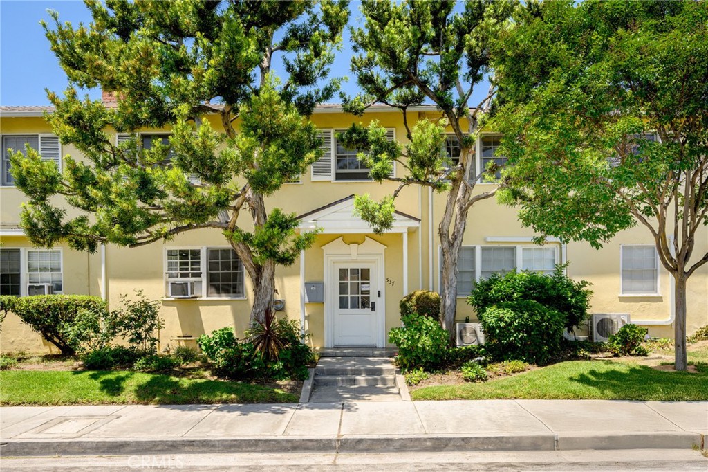 Unique & Updated Condo with 2 Private Entrances. Discover this rare condo that feels like a single-family home! Located on the top floor, this exceptional unit offers privacy, with none of the entire 4 side-walls touching neighboring units. Private entrances from the front and rear door, and a private balcony overlooking the Verdugo Mountains, give you exclusive access and a house-like feel. Inside, you'll find thoughtfully updated features throughout, including upgraded electrical & plumbing, tankless water heater, as well as modern kitchen cabinets, countertops, tile-work, and appliances. The open-concept living space provides lots of natural light and includes gorgeous hardwood floors, mini-split units in both the living room and bedroom for energy-efficient comfort year-round. A reverse osmosis water filtration system adds convenience and quality to daily living, and a washer and dryer in the unit make laundry easy. This condo also includes a private garage with a remote opener simplifying your parking and storage. The complex also features a new roof and beautifully landscaped tree-lined gardens offering a tranquil oasis. This is a rare opportunity to own a stylish, peaceful & turnkey home with privacy and modern upgrades—don’t miss it!
