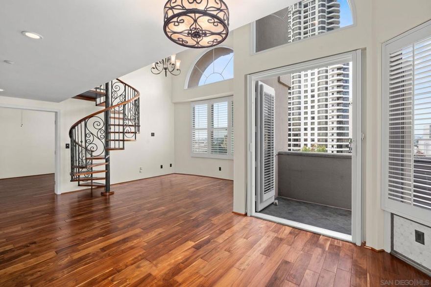 Top-Floor Condo with Bay Views in the Heart of the Marina District! Welcome to the Watermark, a boutique midrise building in Downtown San Diego. This west-facing 4th-floor residence offers vaulted ceilings, arched windows, and no one above you. Enjoy bay views and fireworks year-round from your private terrace, accessible via French doors from the living room and bedroom. Open kitchen with custom cabinetry and a counter-height bar flows into the great room. A custom spiral staircase leads to a spacious loft, adding bonus square footage. Just steps to Little Italy, the Embarcadero, and top dining & entertainment. Only 96 residences in this urban-classic community.  Welcome to the Watermark – A Boutique Midrise in the Heart of the Marina District, Downtown San Diego Discover urban living at its finest in this beautifully appointed fourth-floor residence in the sought-after Watermark building. Perfectly situated in the vibrant Marina District, you’re just steps from the best of Downtown dining, Little Italy, the Embarcadero, and year-round waterfront activities. This west-facing home offers stunning bay views and front-row seats to fireworks displays throughout the year. As a top-floor unit with no one above, you'll enjoy added privacy and tranquility. Soaring vaulted ceilings and expansive arched windows fill the space with natural light, creating an airy, open ambiance. The open-concept kitchen is designed for both style and functionality, featuring custom cabinetry, ample counter space, and a counter-height breakfast bar that seamlessly flows into the spacious great room—ideal for entertaining or relaxing in style. One of the standout features is the elegant spiral staircase leading to a versatile loft space—perfect for a home office, studio, or guest area. Bonus: the loft adds additional square footage beyond the standard floor plan. Step through French doors from both the living area and one of the bedrooms onto a private terrace to enjoy ocean breezes, sunset views, and San Diego's unbeatable climate. The Watermark is a boutique-style condominium community with only 96 residences, centered around a beautifully landscaped courtyard. Its timeless urban-classic design and prime location make it a true gem in the Marina District. Come experience the perfect blend of elegance, location, and lifestyle—all year long at the Watermark.
