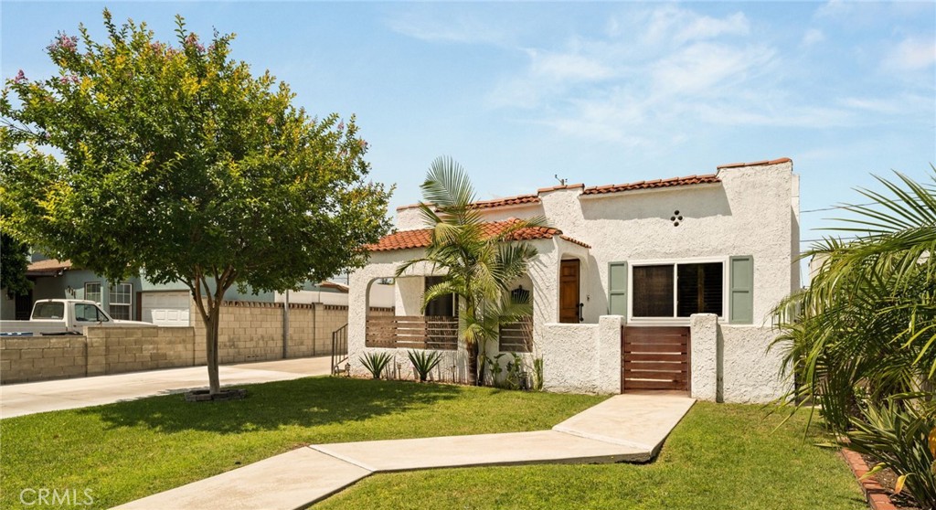 Spanish Charmer with Studio!
This 3-bedroom, 2-bathroom home with a fully detached studio is bursting with character and modern appeal. From the moment you arrive, you’re welcomed by a charming covered front porch and a cozy enclosed sitting area—perfect for unwinding or sipping your morning coffee. Inside, soaring vaulted ceilings and rich wood floors set a warm and inviting tone.
The thoughtfully updated layout features new flooring, stylish modern fixtures, and abundant natural light throughout. Each bedroom includes wall-to-wall closets for generous storage, while the primary suite feels like a true retreat with its spa-inspired bath, complete with a walk-in shower, double vanity, and designer finishes.
What truly sets this property apart is the completely separate studio—ideal as a second primary suite, private guest quarters, or a high-income rental.
Additional highlights include a fully owned solar system, custom landscaping, and an extra-wide extended driveway. The private backyard offers a covered patio, a lush grassy area, and mature trees that create a serene outdoor setting. A detached 1-car garage adds the finishing touch to this exceptional Chandler Park gem.