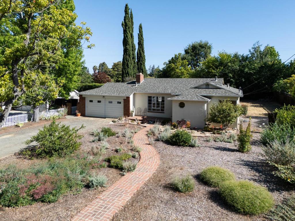 Outstanding opportunity in Prestigious North Los Altos! Fabulous and rarely available 12,000 sf. rectangular deep lot (80 ft wide x 150 ft deep) on one of THE BEST tree-lined streets in town. Just half a mile from downtown in a premier North Los Altos neighborhood - you can rent or live in and enjoy today while you draw up your building plans. Full of character this home exudes old world charm with a large front window, stucco exterior, brick accents and walkway. Living room boasts high open-beamed ceiling. Sunlit kitchen with newer appliances including a gas cook-top. Separate dining area opens to the yard. 3 bright bedrooms with California Closets; hallway bathroom with dual sink vanity, and shower over tub. Plus, convenient half bath. HW floors, AC, Lutron dimmers, newer roof (2020). Utility basement with space for storage. Finished garage area with beam ceilings. Amazing open yard space with drought tolerant plants, meyer lemons, and brick patio with covered space. Los Altos schools: Santa Rita Elem, Egan Junior High, Los Altos High. Super convenient to Los Altos downtown, all three schools, San Antonio Center, Trader Joes, Whole Foods, and local favorites - DeMartini & Draeger's. Easy commute access to Hwy 280, 101, 85, and to many tech firms including Google, Apple, Meta